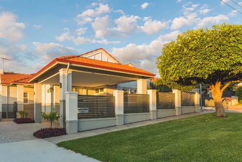 Contemporary carport design with fence feature